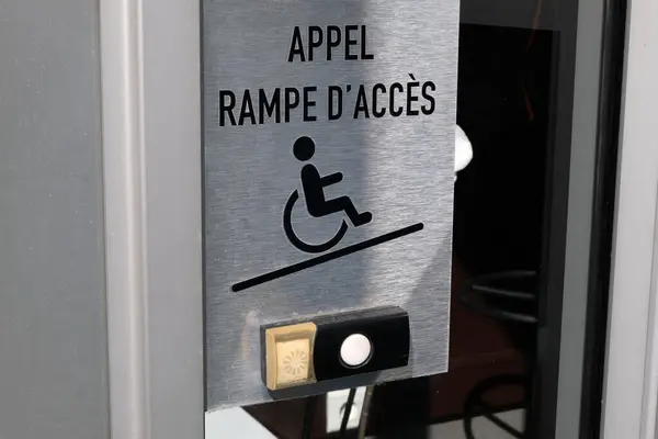 Call sign of a ramp for wheelchair users in a store close-up
