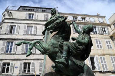 Statue of Eugene Fromentin at Place des Petis-Bancs in the city of La Rochelle made by the sculptor Ernest Dubois clipart