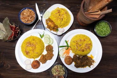 Picture of three different Khichuri Chicken, Beef, and Egg Khichuri, placed on isolated table clipart