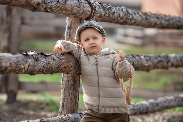 Portrait Bully Boy Kid Slingshot Aims Someone Fence Village Outdoors — Fotografia de Stock