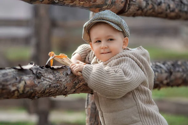 Portrait Bully Boy Kid Slingshot Aims Someone Fence Village Outdoors Stockfoto