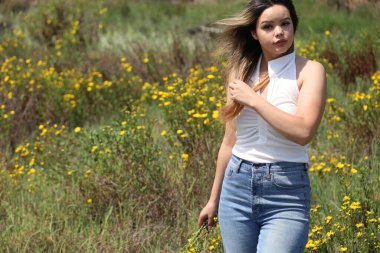 Photo of beautiful lady in a park on a summer day