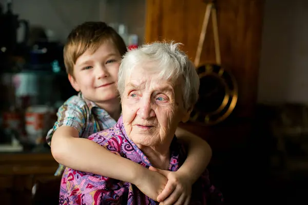 stock image Psychological portrait of an elderly woman with her grandson.