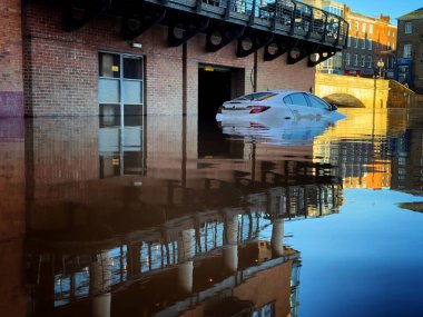 Car in the floods in York clipart