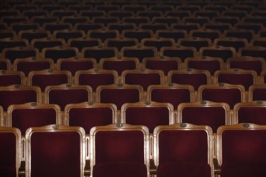 Row of red seats in theatre for design purpose