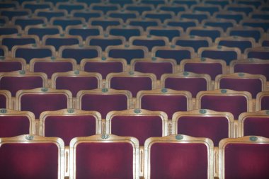 Row of red seats in theatre for design purpose