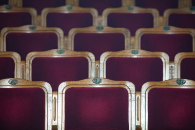 Row of red seats in theatre for design purpose
