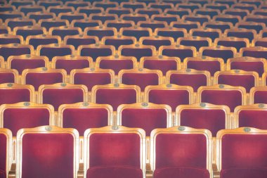 Row of red seats in theatre for design purpose