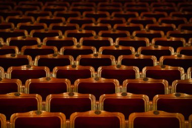 Row of red seats in theatre for design purpose