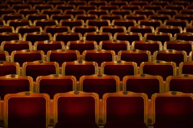 Row of red seats in theatre for design purpose