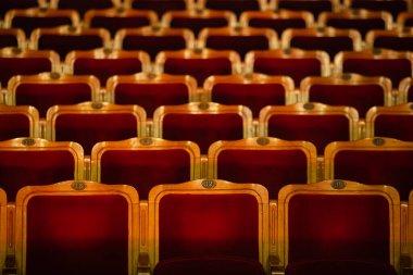 Row of red seats in theatre for design purpose