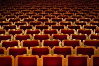 Row of red seats in theatre for design purpose