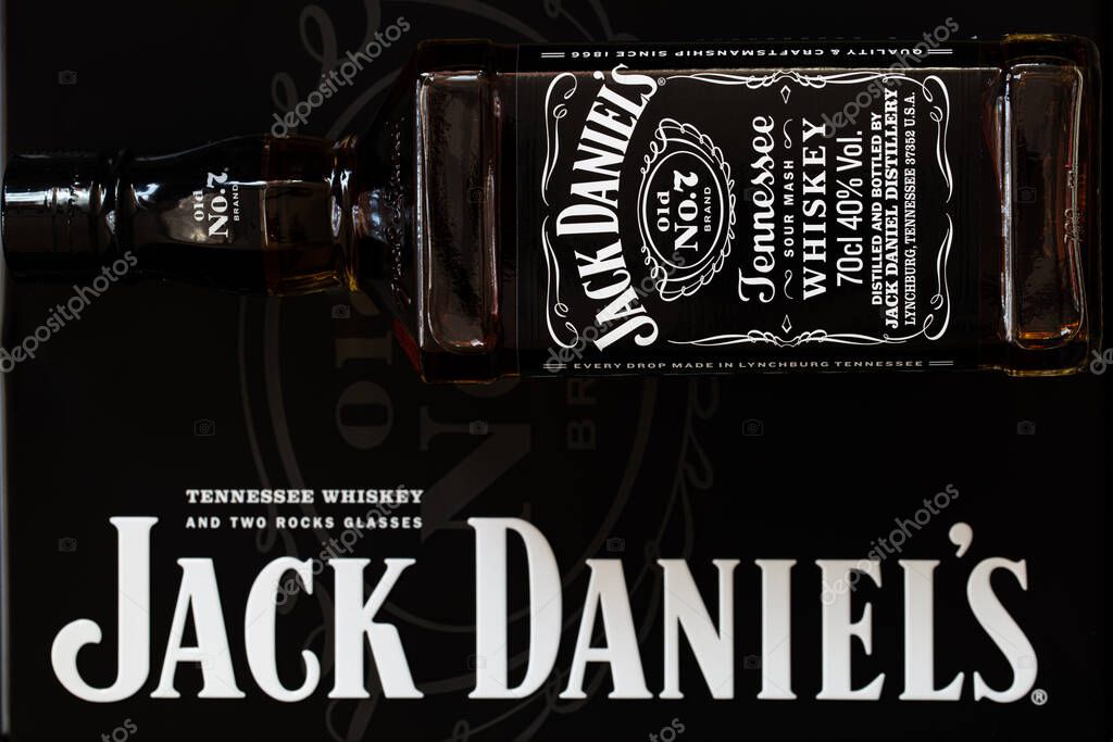 Lviv, Ukraine - 24 December 2017: Jack Daniel's bottle and metal box gift on black background
