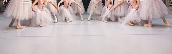 Closeup of ballerinas dancing on stage