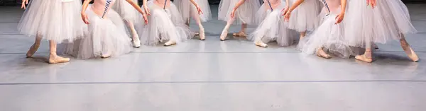 Closeup of ballerinas dancing on stage