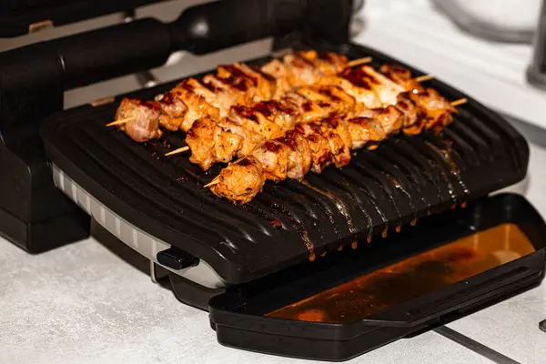 Closeup of meat prepared on electric grill for design purpose