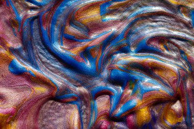 Altın, mavi ve pembe sıvı metalik akrilik boyanın yakın plan tasarım amaçlı dokusu