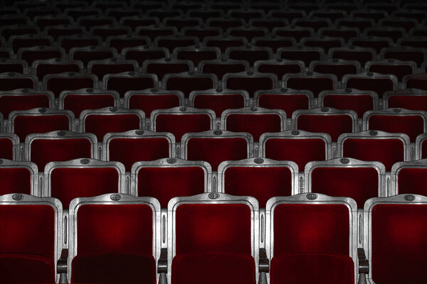 Row of red seats in theatre for design purpose