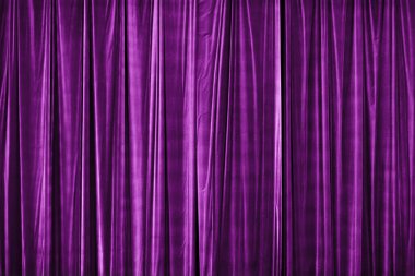 violet curtain in theatre. Textured background