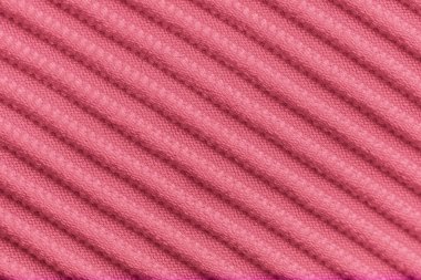 Pembe kadife kumaşın tasarım amaçlı desenli arka plan olarak yakınlaştırılması