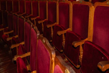Row of red seats in theatre for design purpose