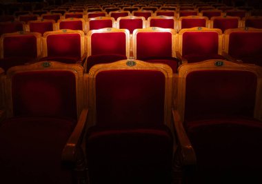 Row of red seats in theatre for design purpose