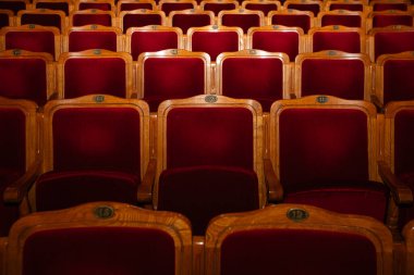 Row of red seats in theatre for design purpose