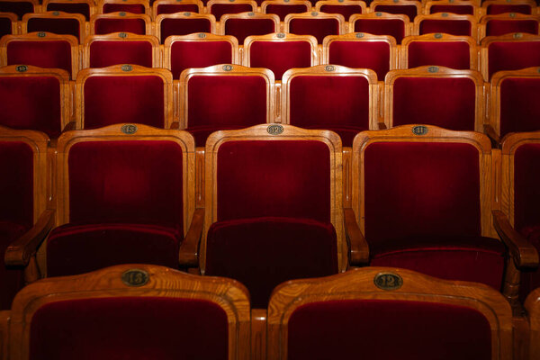Row of red seats in theatre for design purpose