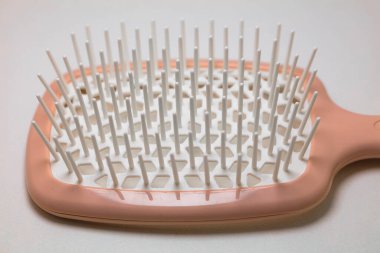 Closeup of pink hairbrush for design purpose clipart