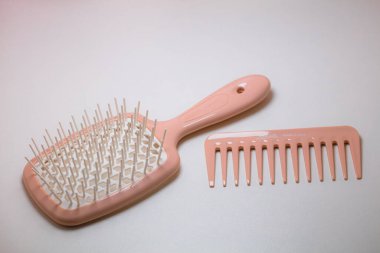 Lviv, Ukraine - July 15, 2024: Pink Janeke Spazzola Superbrush and Pink Janeke Mini Supercomb clipart