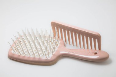 Lviv, Ukraine - July 15, 2024: Pink Janeke Spazzola Superbrush and Pink Janeke Mini Supercomb clipart