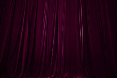 burgundy curtain in theatre. Textured background