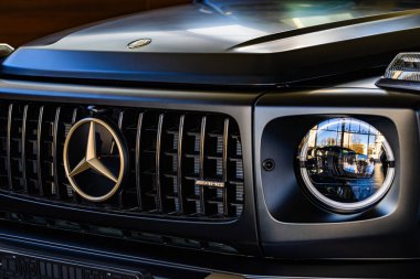 Lviv, Ukraine - November 26, 2024: Closeup of Mercedes-AMG G 63 V8 biturbo car clipart