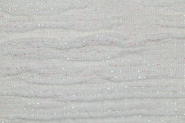 Closeup of white  textured fabric with glitter metallic fiberbackground for design purpose clipart