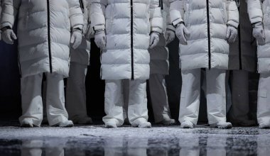 Closeup of men in white puffer coats on stage for design purpose clipart