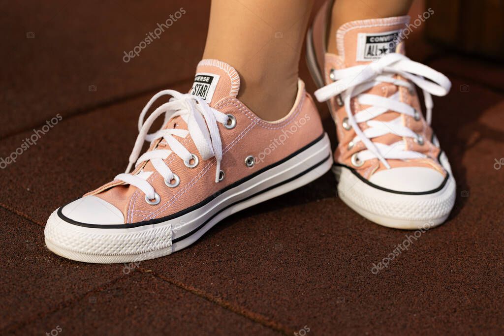 Lviv, Ukraine - April 20, 2025: Converse All Stars sneakers on woman feet