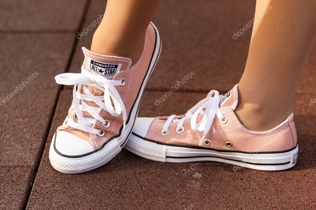 Lviv, Ukraine - April 20, 2025: Converse All Stars sneakers on woman feet