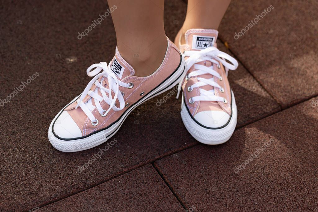 Lviv, Ukraine - April 20, 2025: Converse All Stars sneakers on woman feet