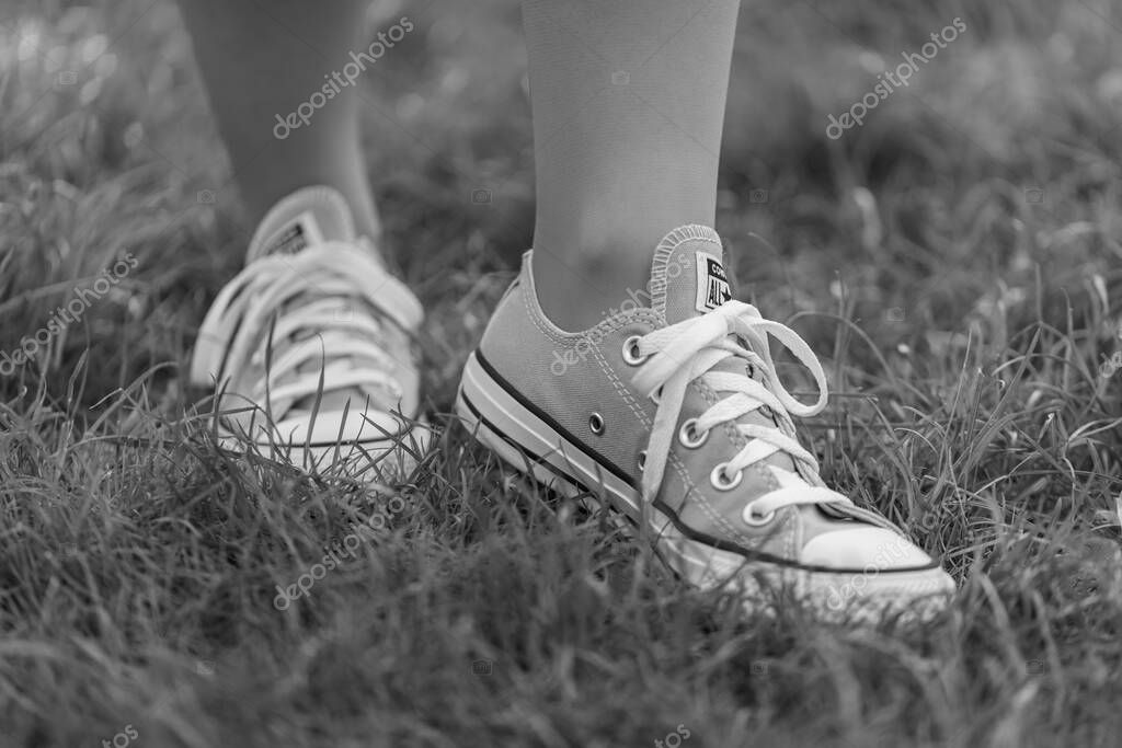 Lviv, Ukraine - April 20, 2025: Converse All Stars sneakers on woman feet