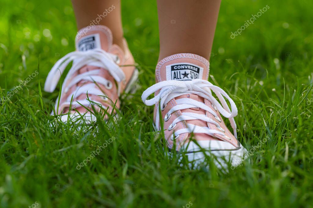 Lviv, Ukraine - April 20, 2025: Converse All Stars sneakers on woman feet