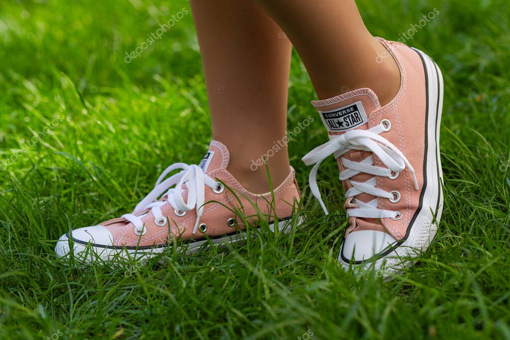 Lviv, Ukraine - April 20, 2025: Converse All Stars sneakers on woman feet