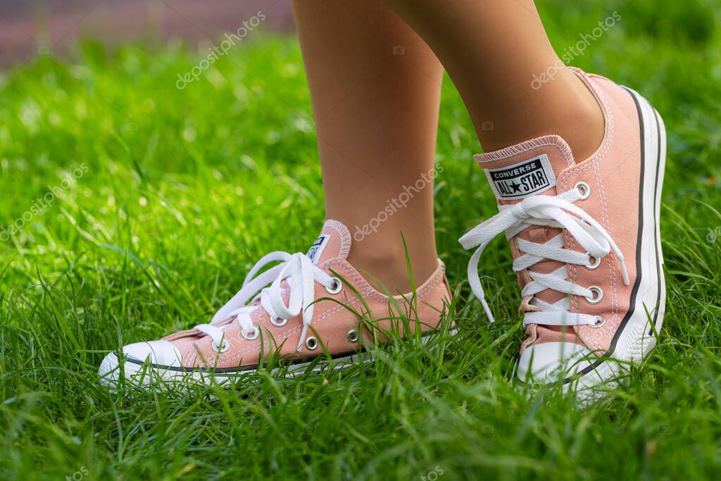 Lviv, Ukraine - April 20, 2025: Converse All Stars sneakers on woman feet
