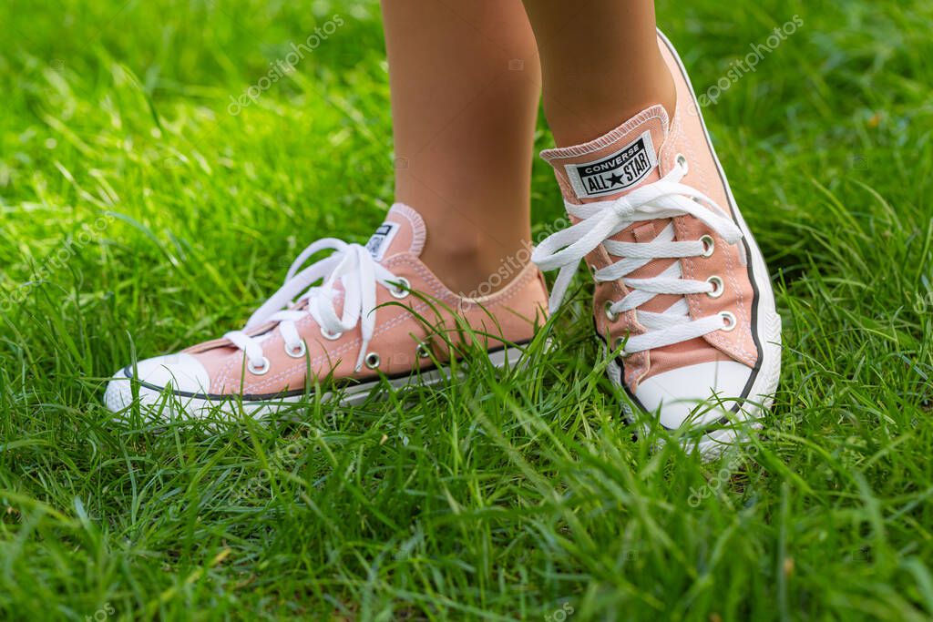 Lviv, Ukraine - April 20, 2025: Converse All Stars sneakers on woman feet
