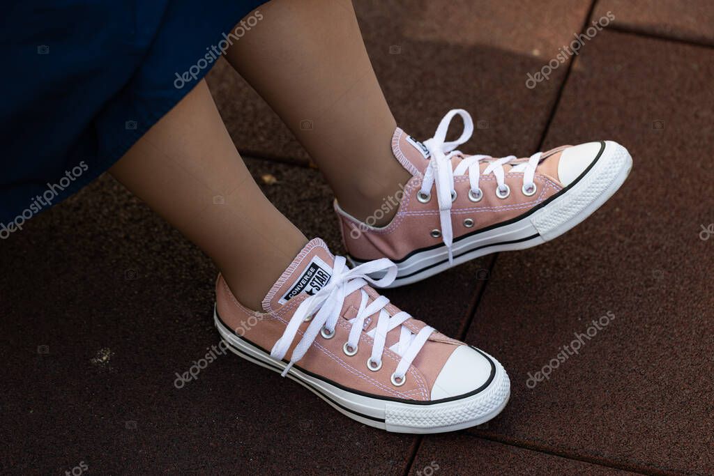 Lviv, Ukraine - April 20, 2025: Converse All Stars sneakers on woman feet