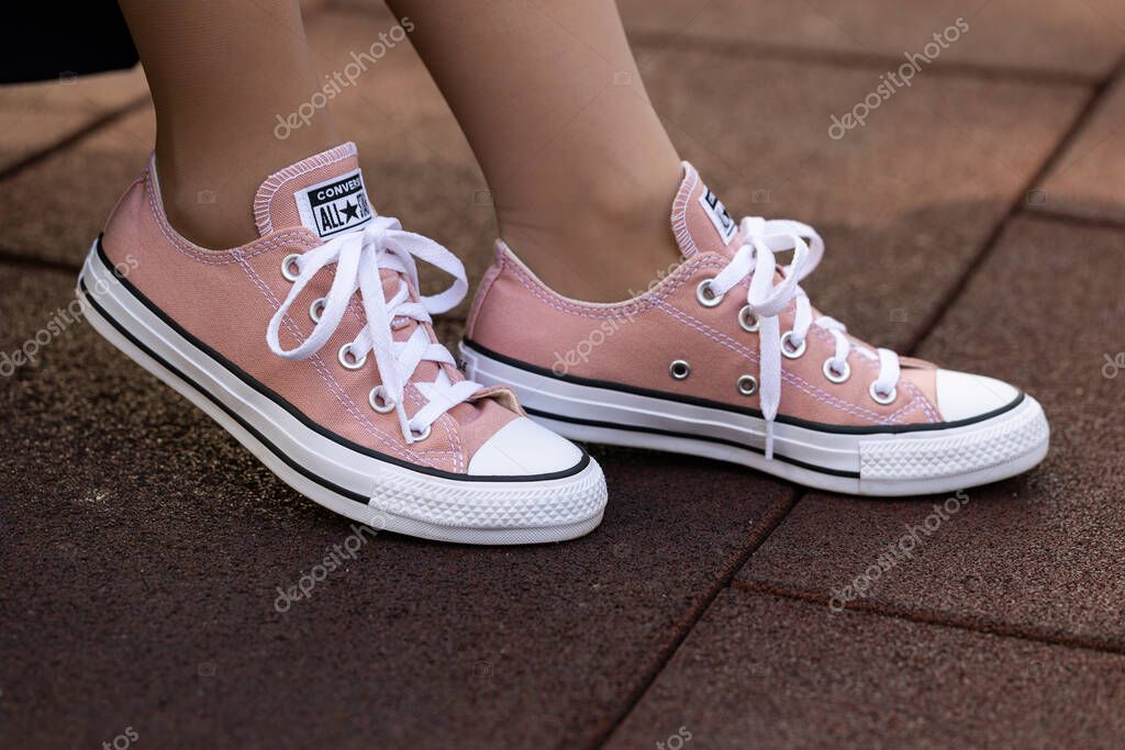 Lviv, Ukraine - April 20, 2025: Converse All Stars sneakers on woman feet
