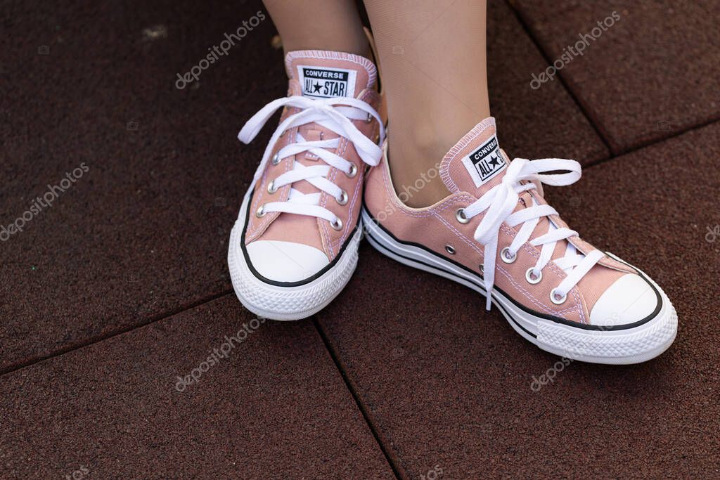 Lviv, Ukraine - April 20, 2025: Converse All Stars sneakers on woman feet