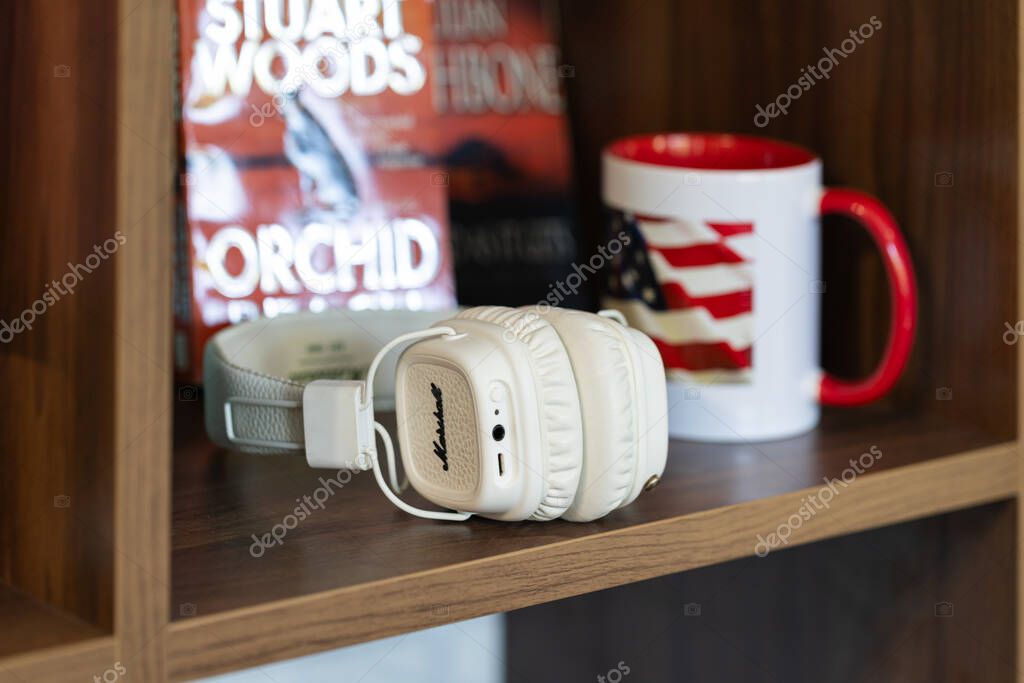 Lviv, Ukraine - April 29, 2024: white Marshall headphones on the table