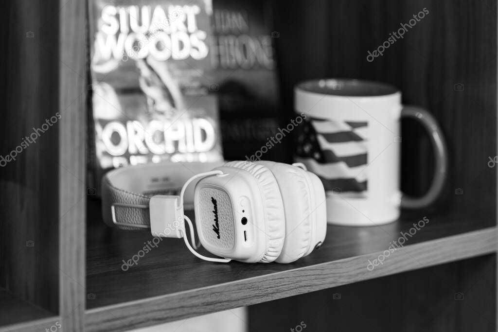 Lviv, Ukraine - April 29, 2024: white Marshall headphones on the table