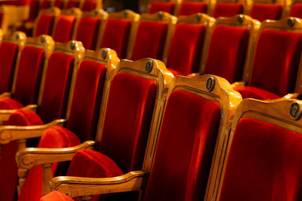 Row of red seats in theatre for design purpose