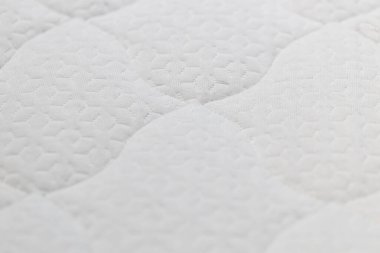 Döşeğin tekstil dokulu arkaplanının kapatılması